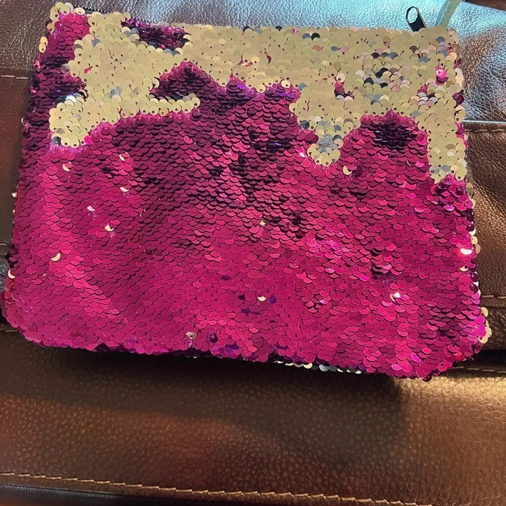 Claire’s color change sequin clutch or cosmetics bag
